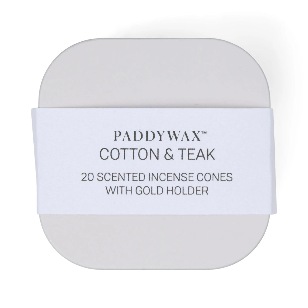 The Cotton & Teak - Metal Incense Tin contains 20 top-selling scented incense cones and includes a gold incense cone holder. The rounded tin features a white paper band with black text.