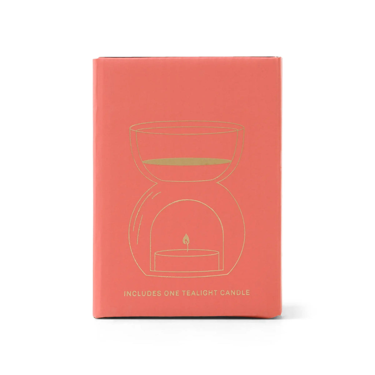 Amber Glass - Essential Oil Burner & Tea Light Candle comes in a coral-colored box featuring a gold line drawing of a tea light candle holder and the message “Includes one tealight candle” on the front—ideal for pairing with amber glass decor or as an essential oil burner.
