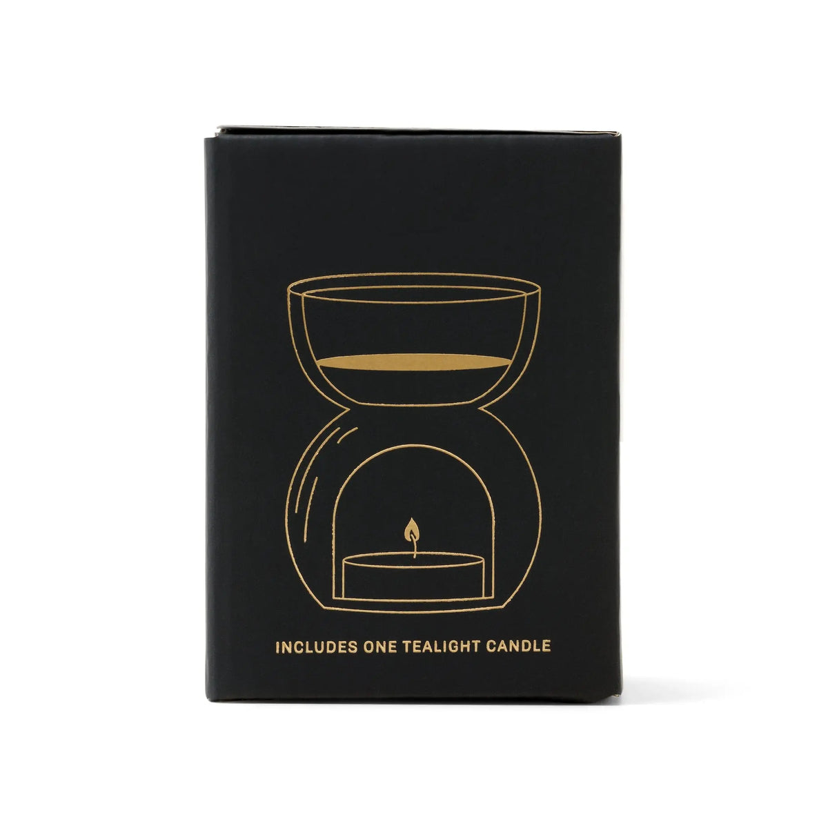 A black box featuring a gold line illustration of the Black Glass - Essential Oil Burner & Tea Light Candle. The text at the bottom reads, Includes one tealight candle.