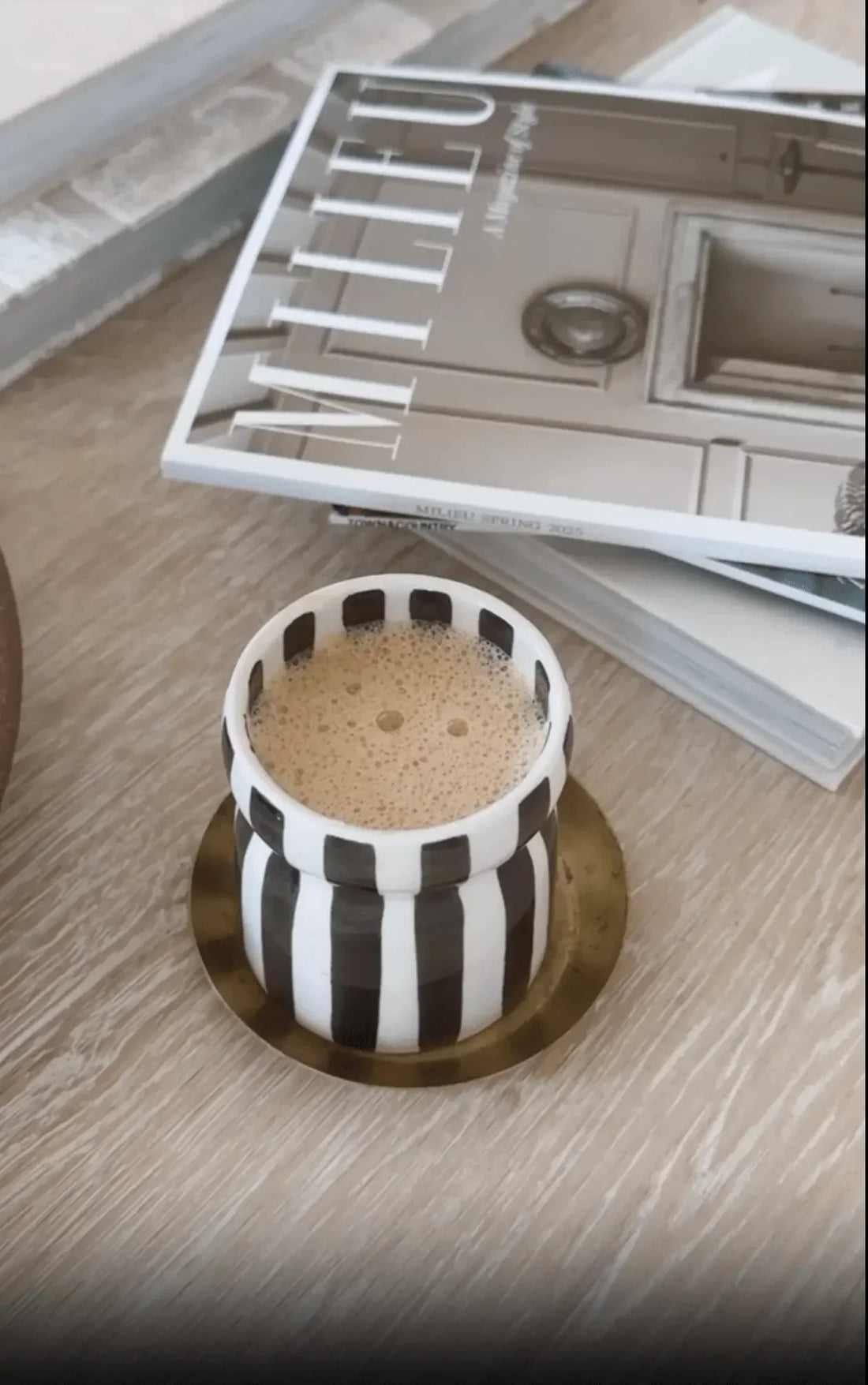 Paddywax food safe candle being used as a drinking mug.