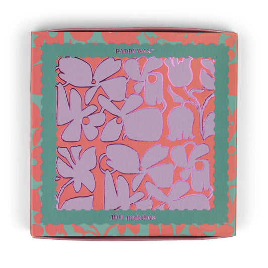 The Abstract Floral - Teal Matches matchbox features a purple and pink floral pattern with teal and coral borders, holds 100 jumbo matches—perfect as a candle accessory.