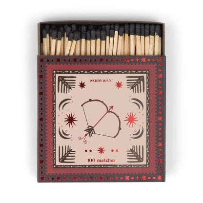 Bow & Arrow - Black Matches: A decorative matchbox with 100 jumbo black-tipped matches, featuring a bow and arrow design with red stars—perfect as a stylish candle accessory for your home.