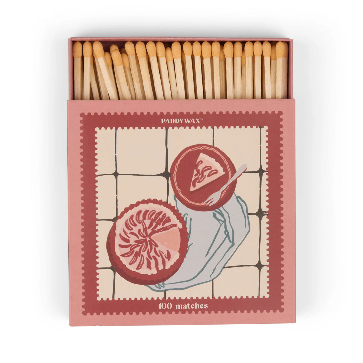 An open box labeled “Picnic & Pie - Peach Matches” reveals wooden matches inside, featuring an illustration of two halved pomegranates on a tiled background.