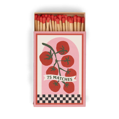 A Dopo "Tomato Vine" - 75ct Boxed Matches: 75 safety matches with red tips in a box featuring a tomato vine illustration on a pink background and checkerboard border, inspired by the charm of Mediterranean travel.
