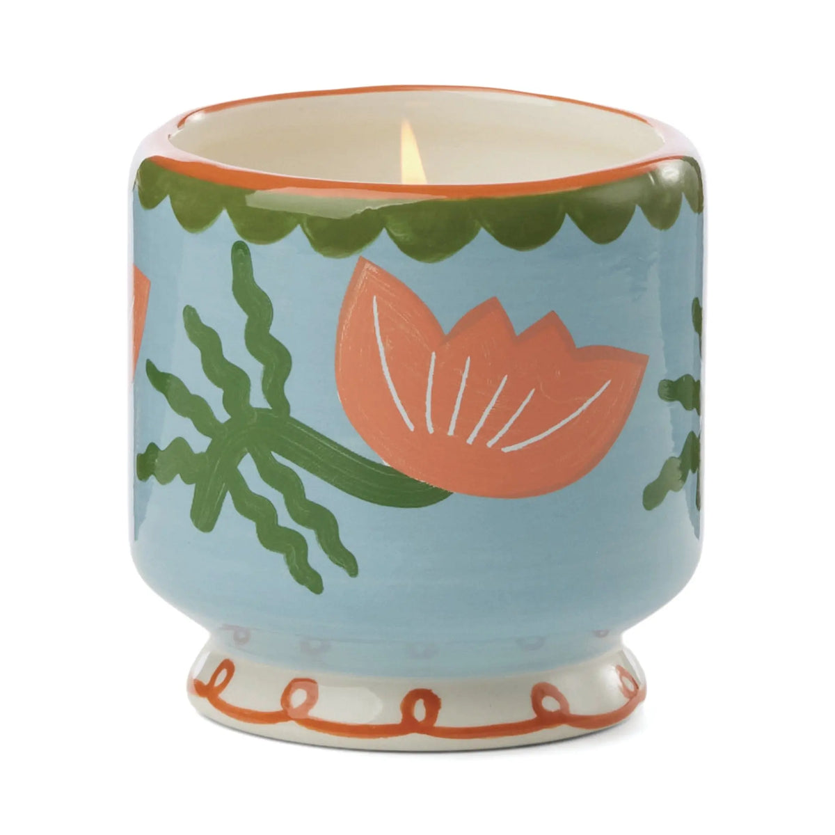 The Cactus Flower - A Dopo 8 oz Candle, hand-painted in a blue ceramic holder adorned with pink flowers and green leaves, fills your space with a calming Mediterranean scent.