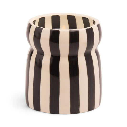 The Lava Stone - Cabana 6.5 oz Black Candle features a ceramic vessel with vertical black and white stripes and a subtly indented middle, ideal for showcasing hand painted candles.