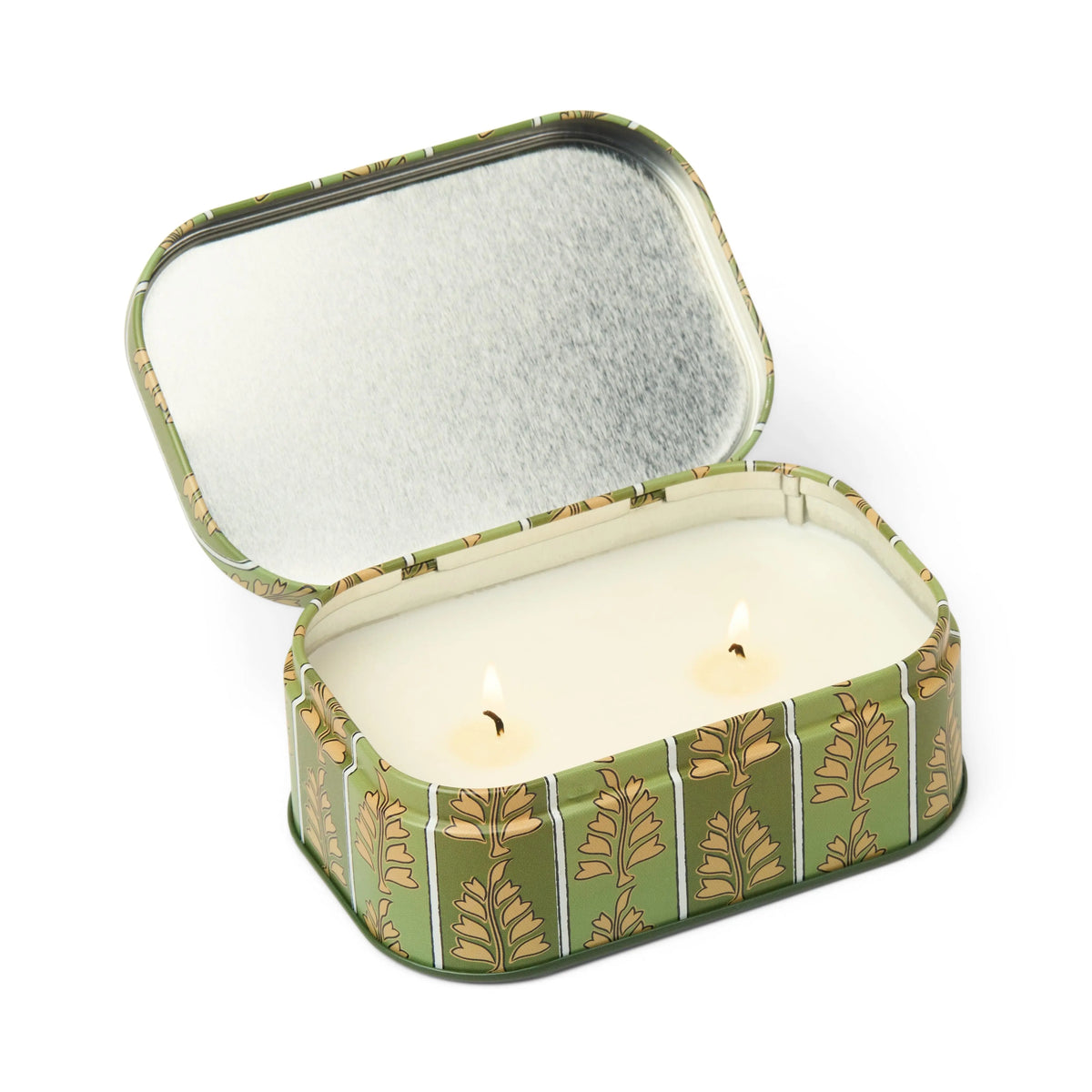 The Chérie 4.5 oz Tin Candle in Smoked Pistachio features a green, rectangular reusable tin adorned with a decorative leaf pattern. Its open lid reveals a silver interior that complements the white candle inside, which has two burning wicks and fills the air with its unique gourmand fragrance.