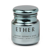 A metallic blue jar candle from the Chroma Collection, labeled Sea Salt & Sage - Chroma 2.5 oz Candle, features electroplated glass with a reflective finish and a rounded lid.