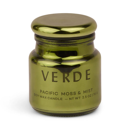 A metallic green, electroplated glass jar labeled Pacific Moss & Mist - Chroma 2.5 oz Candle. The jar features a rounded lid and a simple, modern design, reflecting the sophisticated style of Chroma candles and their Latin-inspired fragrance collection.