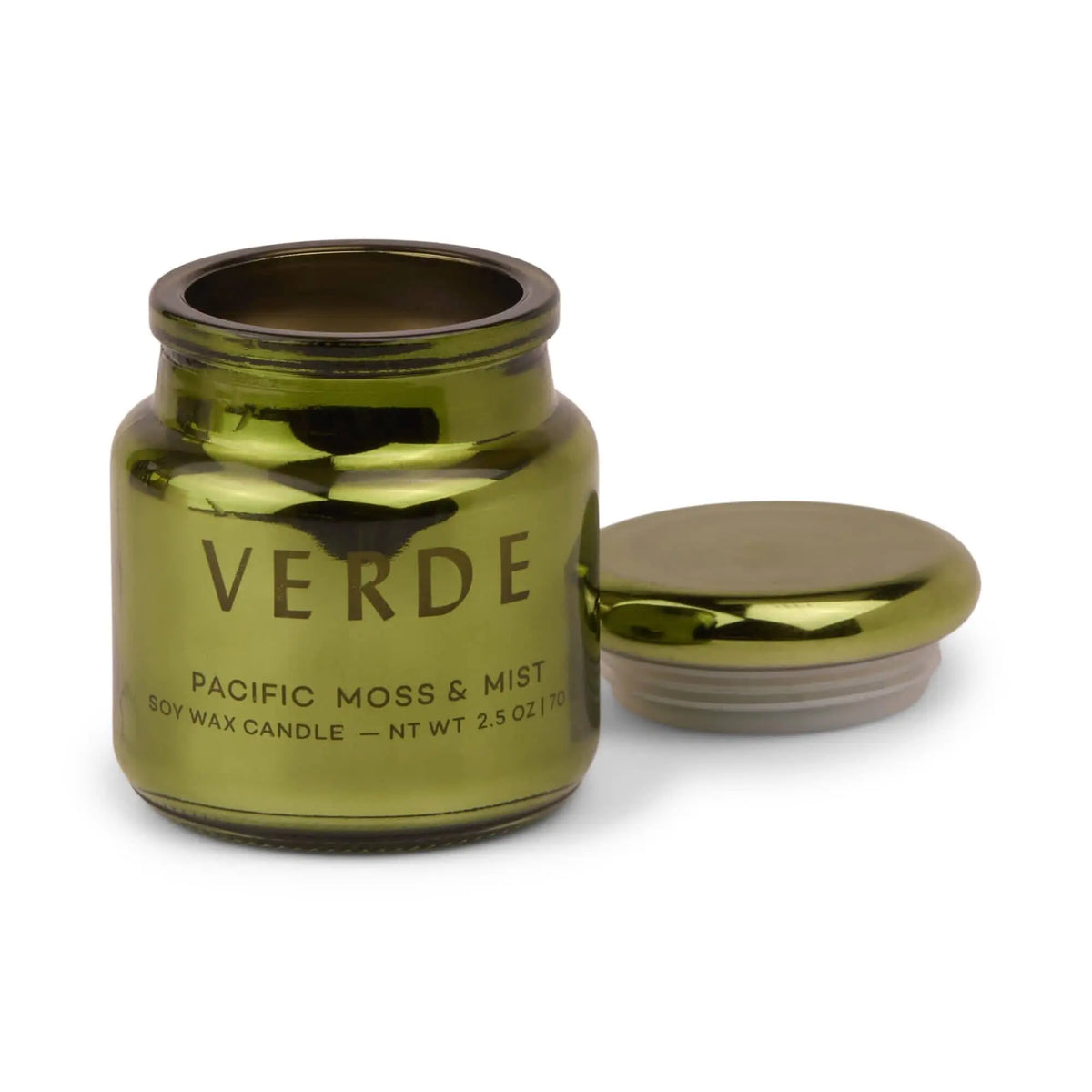 A shiny green, electroplated glass jar labeled "Pacific Moss & Mist - Chroma 2.5 oz Candle" sits with its matching lid placed beside it on a white background. This candle features a Latin-inspired fragrance that evokes lush coastal landscapes.