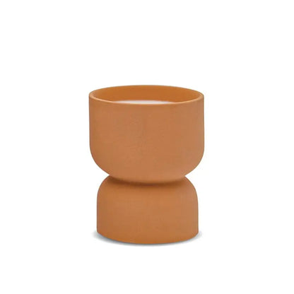 The Wild Fig & Vetiver - Form 6 oz Candle features a small, matte terracotta ceramic cup with a modern double-bowl design—ideal as a planter candle or stylish decorative accent.