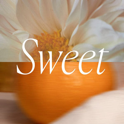 A close-up of a white flower and an orange fruit with the word Sweet overlaid in large white text.