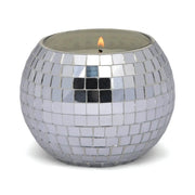 The Sparkling Bergamot - Magique Disco Ball 10 oz candle features a round holder with small, reflective silver mosaic tiles, adding a shiny decorative touch to any space.