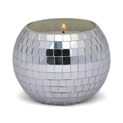 The Sparkling Bergamot - Magique Disco Ball 10 oz candle features a round holder with small, reflective silver mosaic tiles, adding a shiny decorative touch to any space.