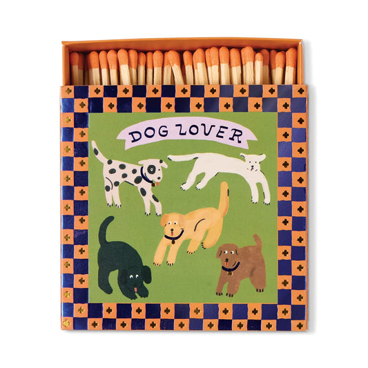 Dog Lover - Square Boxed Matches feature five playful dogs under the words Dog Lover on an illustrated cover, bordered by blue and orange checks—perfect for dog owners and pet lovers.