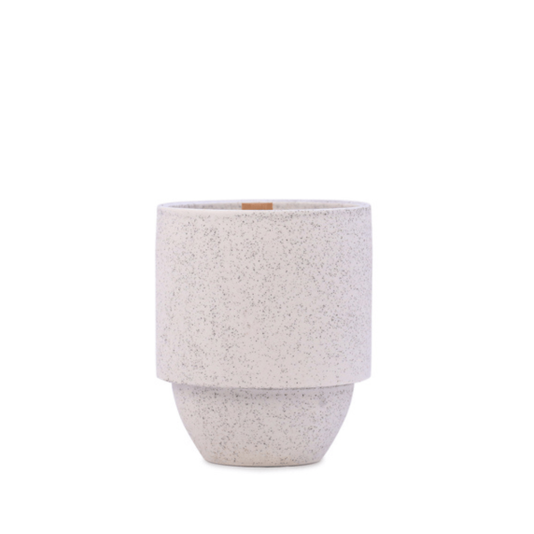 A speckled, light gray ceramic planter pot with a cylindrical top and rounded base, inspired by the tranquil shades of the Glacier - Parks 11 oz Candle collection.