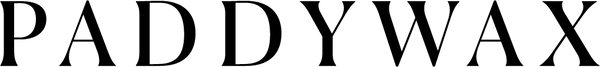 The image shows the word PADDYWAX in large, bold, black capital letters on a light gray background.