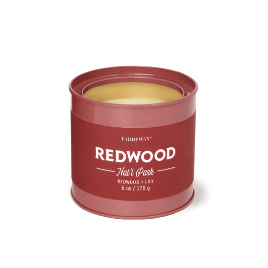 The Redwood - Parks 6 oz Tin Candle features a red tin, light yellow wax, and a fresh Redwood + Lily scent. Inspired by Redwood Natl Park, this outdoor gift is part of Paddywax’s Parks Collection. Net wt: 6 oz (170 g).