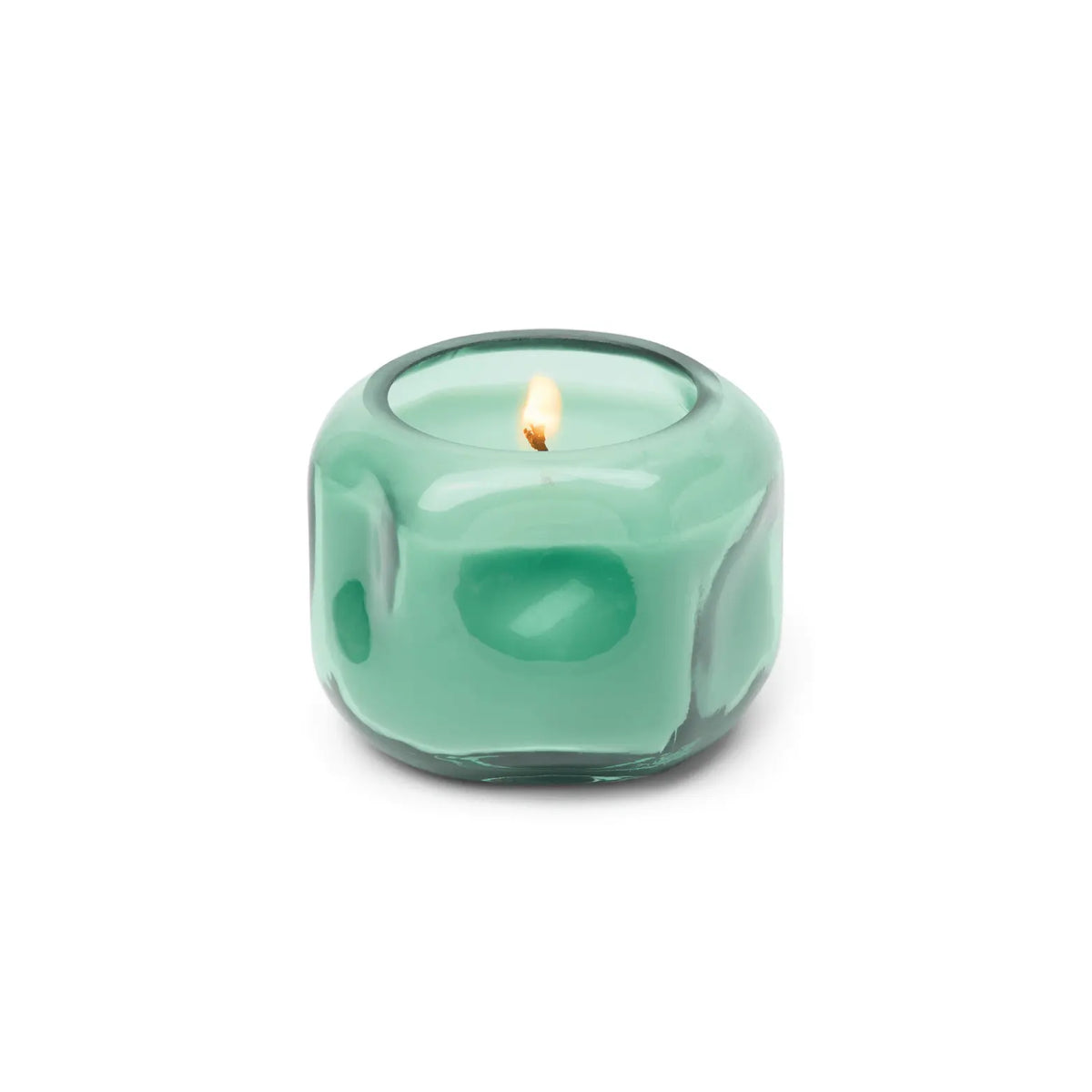 A lit Fresh Air & Sea Salt - Basalt 5 oz Candle in a round, glossy, green glass holder with a smooth, modern design.