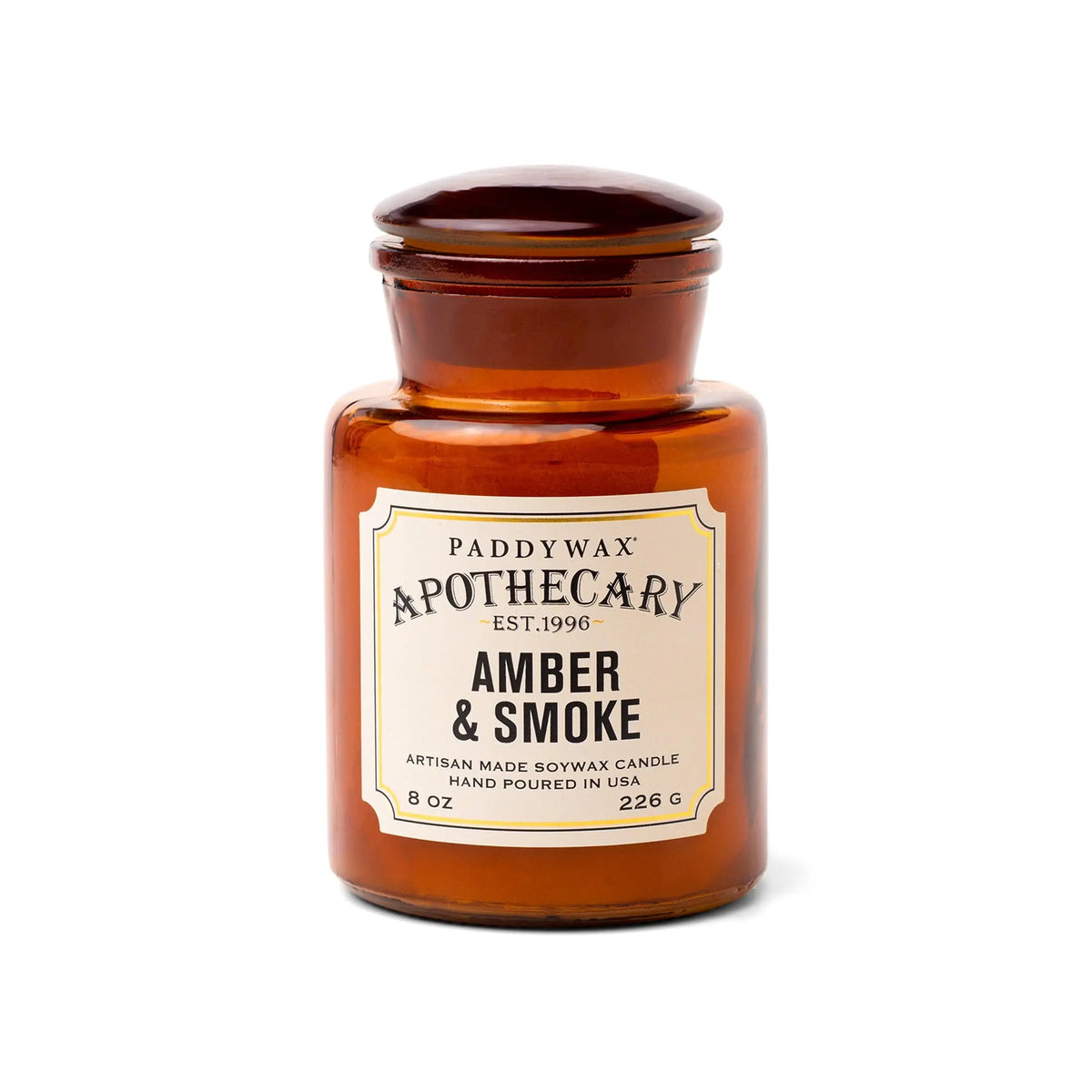 The Amber + Smoke - Apothecary 8 oz Candle is a brown glass soy wax candle with a sealed lid—perfect for those who appreciate elegant, vintage-inspired home fragrances.