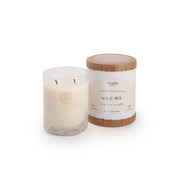 A frosted glass candle from the Classic - Wild Iris collection sits beside its cylindrical box, featuring a wooden lid and a white label that highlights the signature Firefly fragrance.