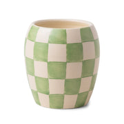 The Checkmate 11 oz Candle – Cactus Flower comes in a ceramic pot with a rounded silhouette, adorned with a hand-painted green and white checkerboard pattern. Its artisanal, slightly uneven finish makes it an eye-catching piece, perfect for those who appreciate unique, reusable decor and handcrafted vessels.