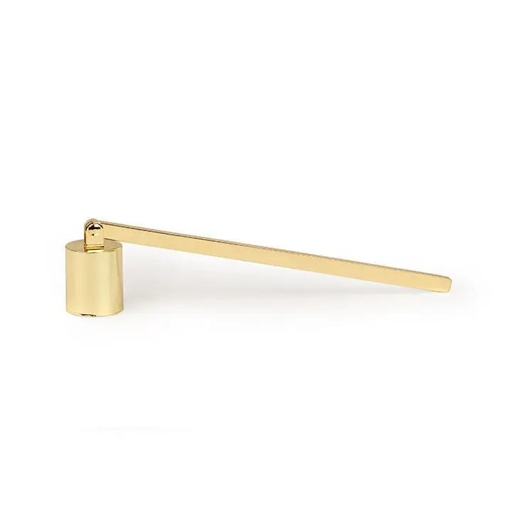 The Candle Snuffer, featuring a gold finish, cylindrical base, and an elongated flat handle, is presented as an elegant candle accessory against a white background.
