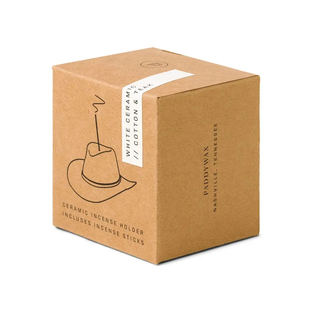 A brown cardboard box labeled Cotton & Teak - Incense Holder features a simple line drawing of a cowboy hat incense holder with smoke and includes incense sticks—making it a unique Nashville gift.