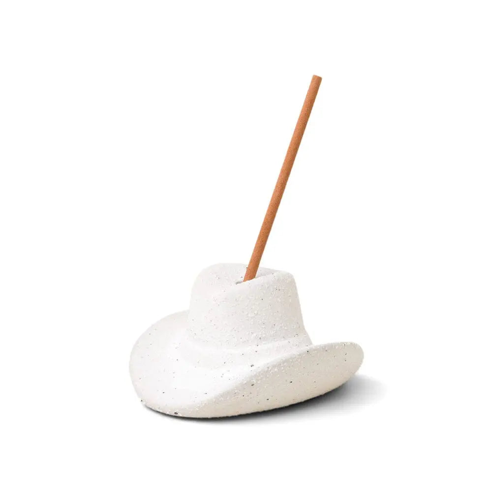 The Cotton & Teak - Incense Holder is a white ceramic cowboy hat that holds a single incense stick upright—a charming burner and perfect Nashville gift.