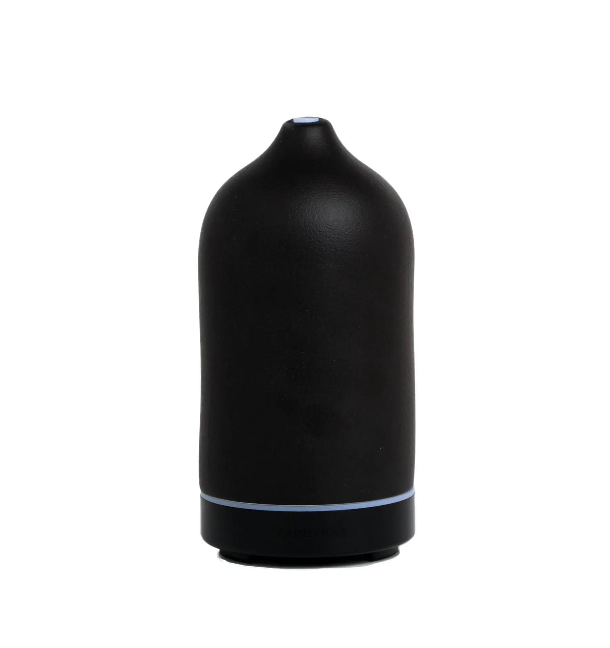 The Electronic Oil Diffuser - Black is a matte black, cylindrical ceramic diffuser with a rounded top and a small opening, designed for aromatherapy, shown sitting on a flat white surface.
