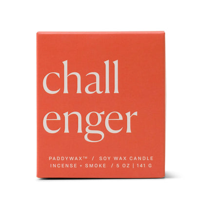 A red candle box with "Challenger" in large white letters. Below, it reads "Paddywax Soy Wax Candle, Incense + Smoke, 5 oz, 141 g" in small white text. This ombre glass candle is part of the Enneagram candles collection—specifically the Enneagram #8 Challenger 5 oz Candle—and features a bold personality fragrance for your space.