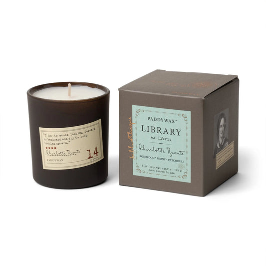 The Charlotte Bronte - Library Candle 6 oz comes in a box with a Brontë quote and features notes of rosewood, peony, and patchouli—the perfect literary-inspired fragrance gift for fans of book-themed candles.