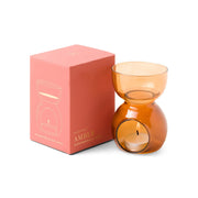 Amber Glass - Essential Oil Burner & Tea Light Candle positioned beside a pink box adorned with an illustration of the burner and detailed product information.