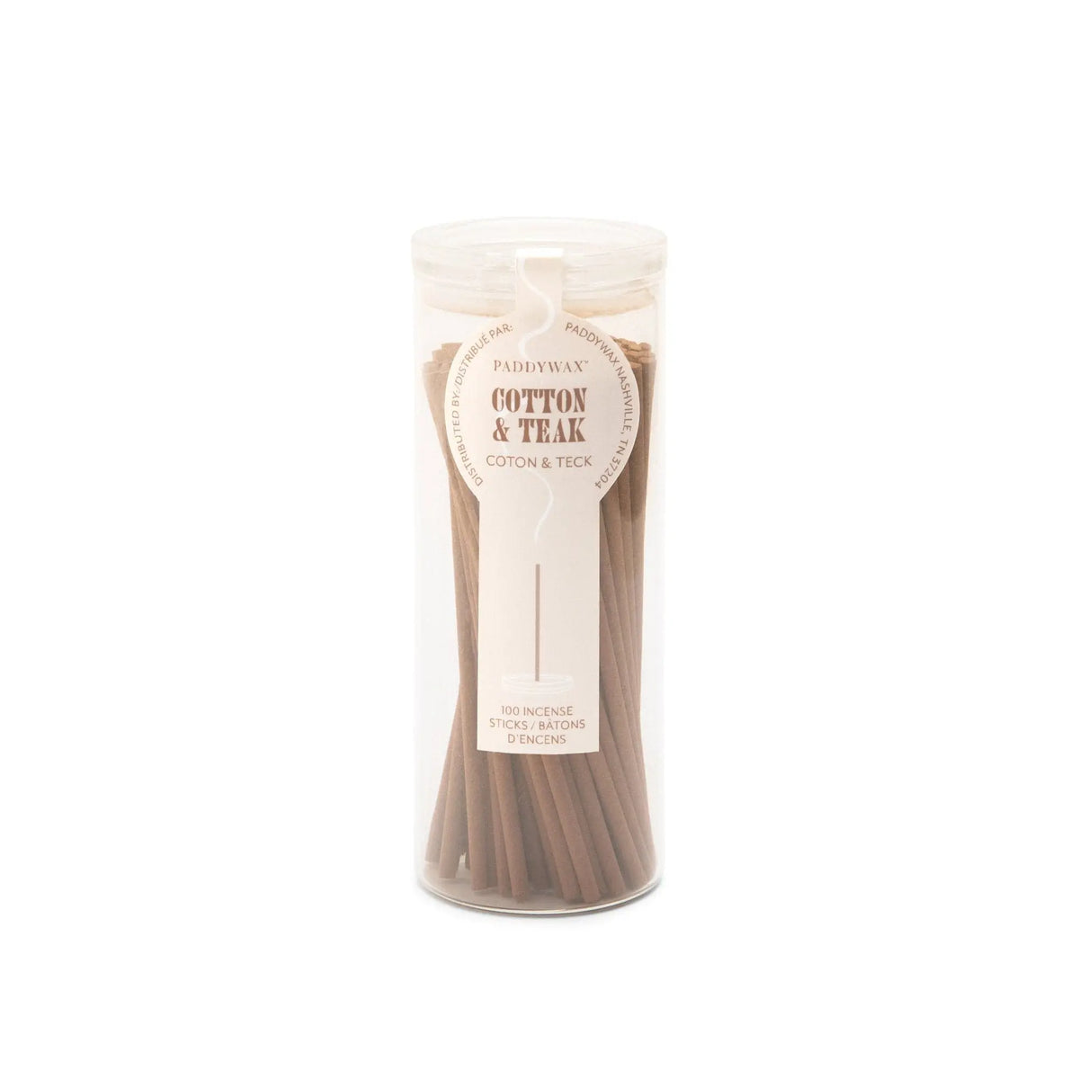 A clear cylindrical container holds brown incense sticks labeled “Cotton + Teak - Haze Incense.” The white label with brown text indicates there are 100 incense sticks inside, making it a perfect addition to any incense collection.
