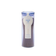 A clear cylindrical container holds brown incense sticks labeled Fresh Air - Haze Incense, with a blue and white tag attached to the top—an elegant addition to any incense collection, perfect for enjoying flameless fragrance throughout your space.