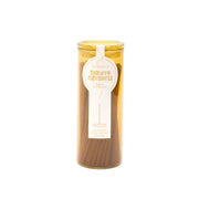 The Tobacco Patchouli - Haze Incense comes in a cylindrical yellow container labeled with "Paddywax," "100 incense sticks," and "Scented Incense." This stylish packaging makes it an eye-catching addition to any incense collection while providing a flameless fragrance experience for your space.