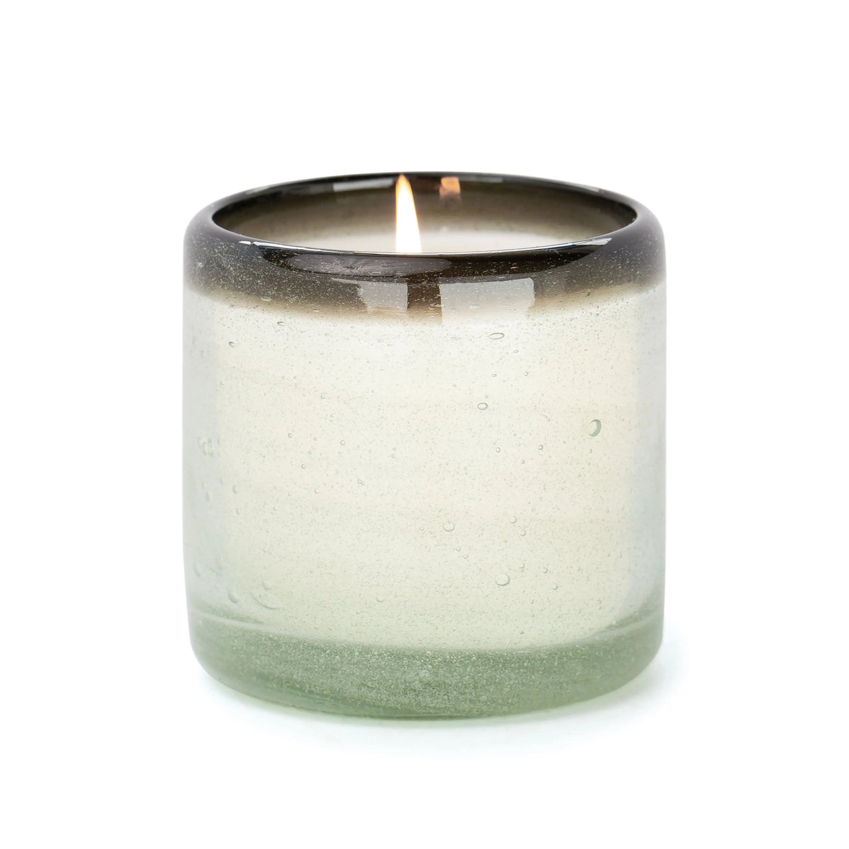 The Vanilla Rosa - La Playa 9 oz Candle glows softly in a translucent, hand-blown bubble glass container, displayed against a plain white background.