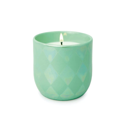 The Matcha & Mint - Lustre Candle 10 oz features a glowing white candle in a light green, quilted ceramic vessel, capturing the fresh scent of matcha and mint, displayed on a plain white background.