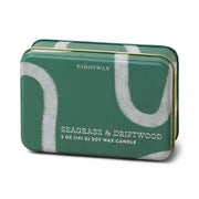 A green rectangular tin candle, Seagrass & Driftwood - 5 oz Tin Candle, with soy wax and white abstract designs.