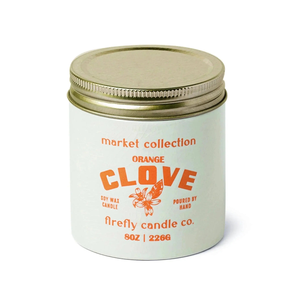 A Market 8 oz Candle - Orange Clove from Firefly Candle Co. features a white jar with a gold lid, orange text, and a flower illustration. Inspired by French open air markets, this candle captures the essence of sweet orange and clove.