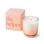 A glowing white Enneagram #2 Helper 5 oz Candle – Violet + Vanilla, in a pink ombre glass holder, sits beside its matching pink box featuring product details on the front—an ideal addition to any Enneagram candles collection or a thoughtful fragrance gift set.